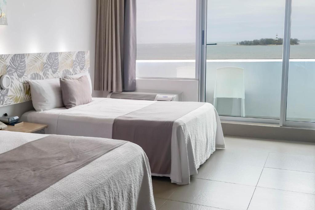 Postel nebo postele na pokoji v ubytování Hotel Punta Azul