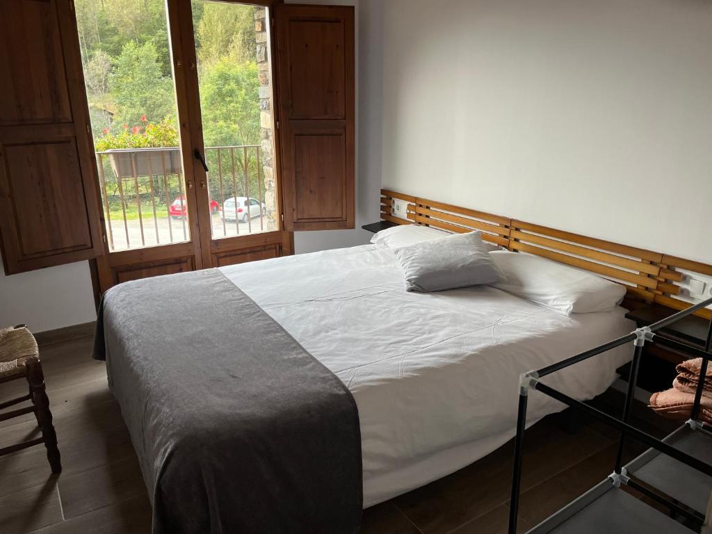 Postel nebo postele na pokoji v ubytování Les Planes