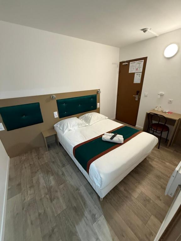 Postel nebo postele na pokoji v ubytování Fasthotel - Soissons Nord