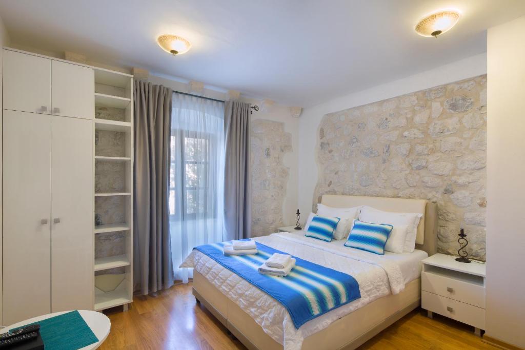 Postel nebo postele na pokoji v ubytování Villa Gina