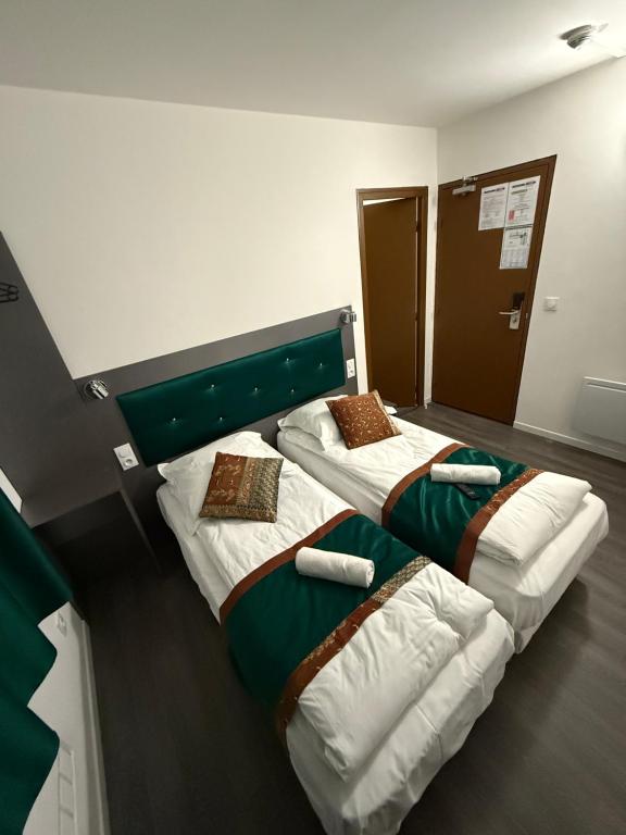 Postel nebo postele na pokoji v ubytování Fasthotel - Soissons Nord