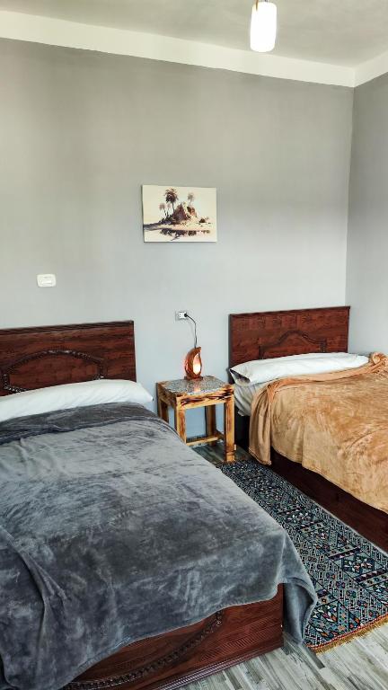 Postel nebo postele na pokoji v ubytování Laila's Home