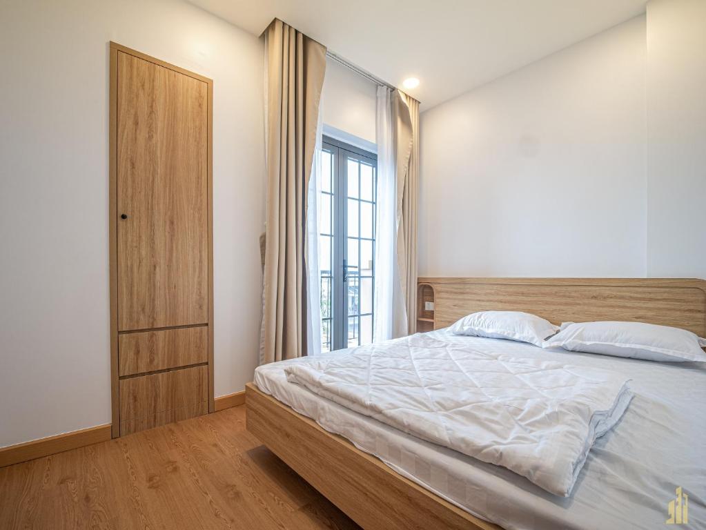 Giường trong phòng chung tại Villa LFP Novaworld Phan Thiết