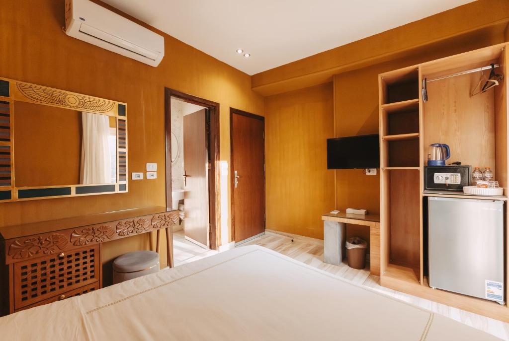 Postel nebo postele na pokoji v ubytování Almas Pyramids Hotel