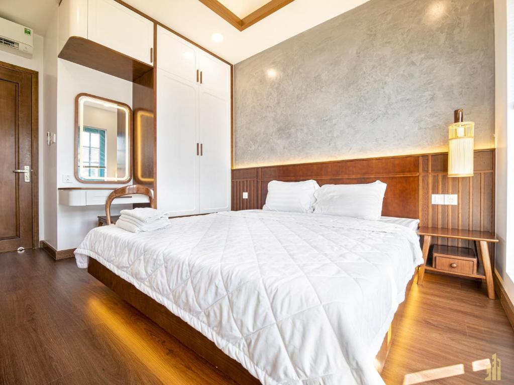 Giường trong phòng chung tại Villa LFP Novaworld Phan Thiết