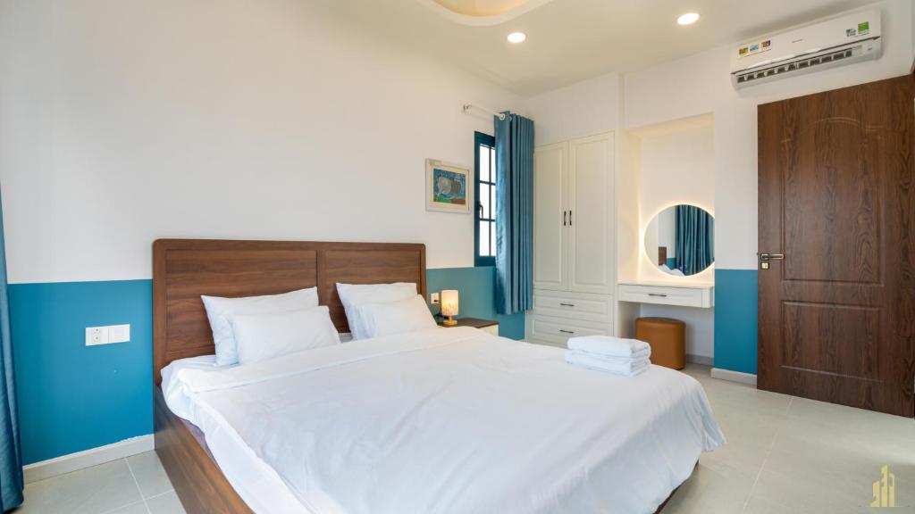 Giường trong phòng chung tại Villa LFP Novaworld Phan Thiết
