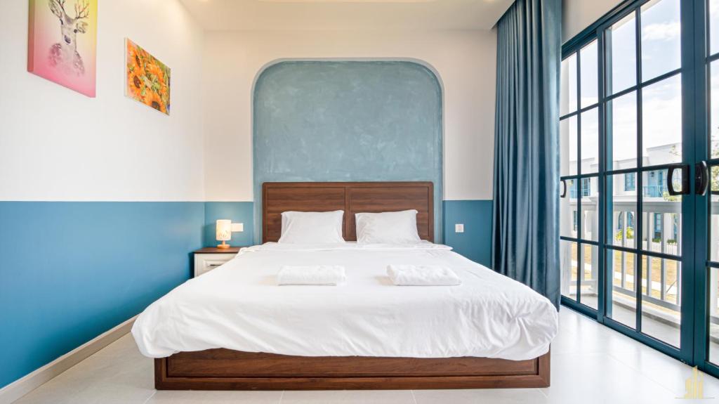 Giường trong phòng chung tại Villa LFP Novaworld Phan Thiết