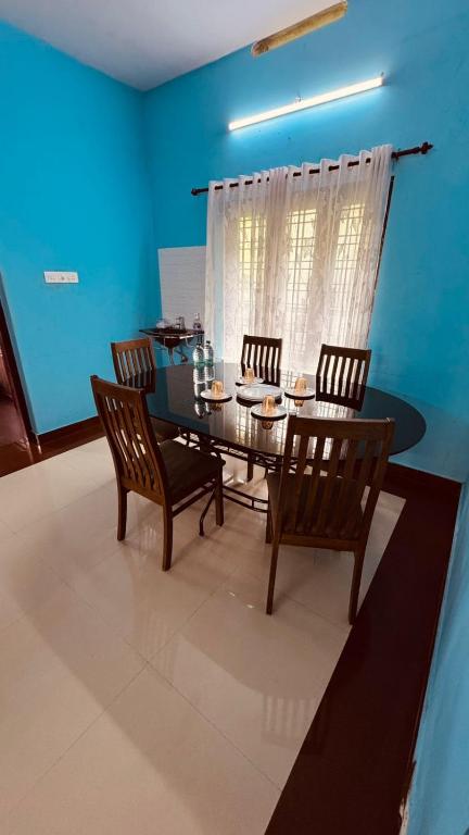 Posezení v ubytování Souparnika Homestay Varkala