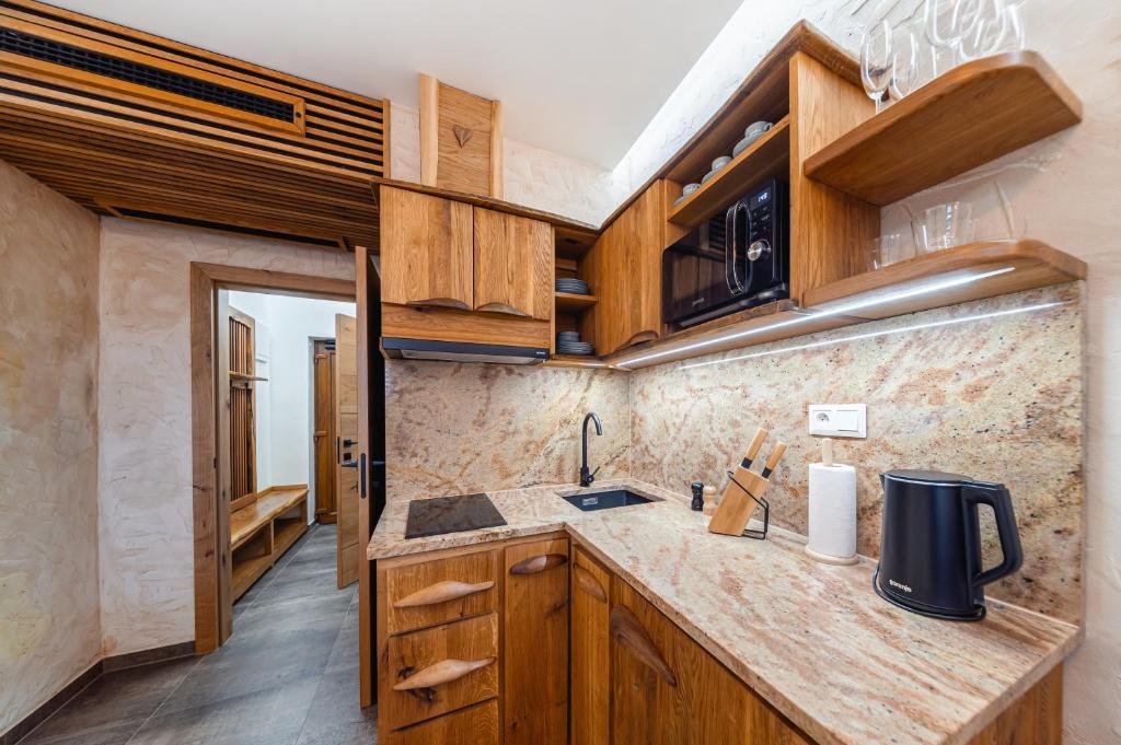 Kuchyň nebo kuchyňský kout v ubytování ANTONIO Apartments