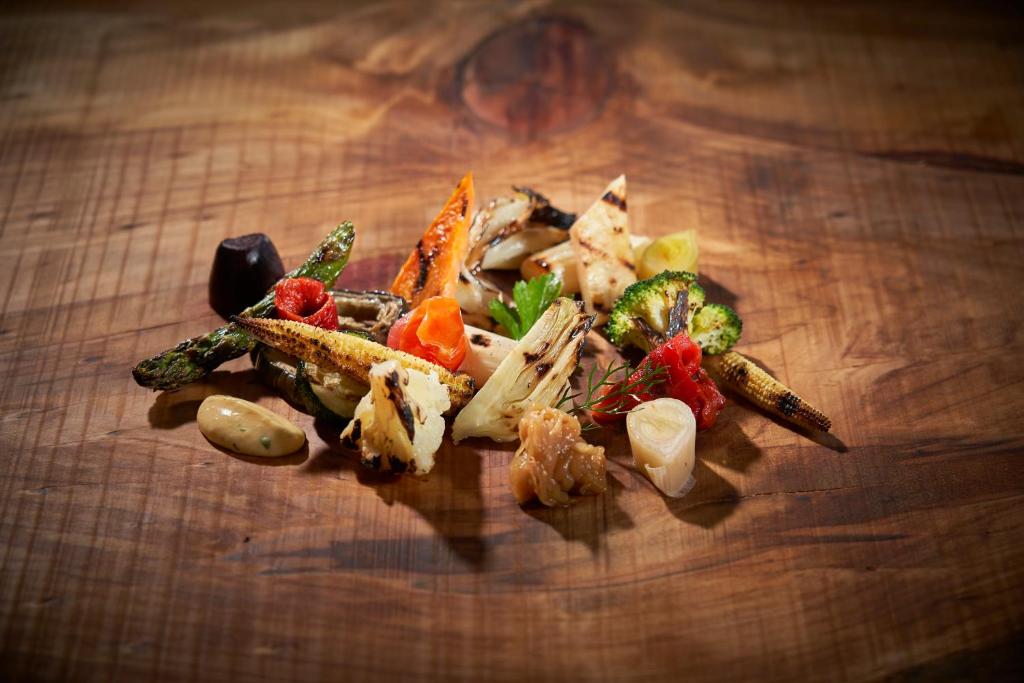a pile of vegetables on a wooden table at PortoBay Blue Ocean in Albufeira