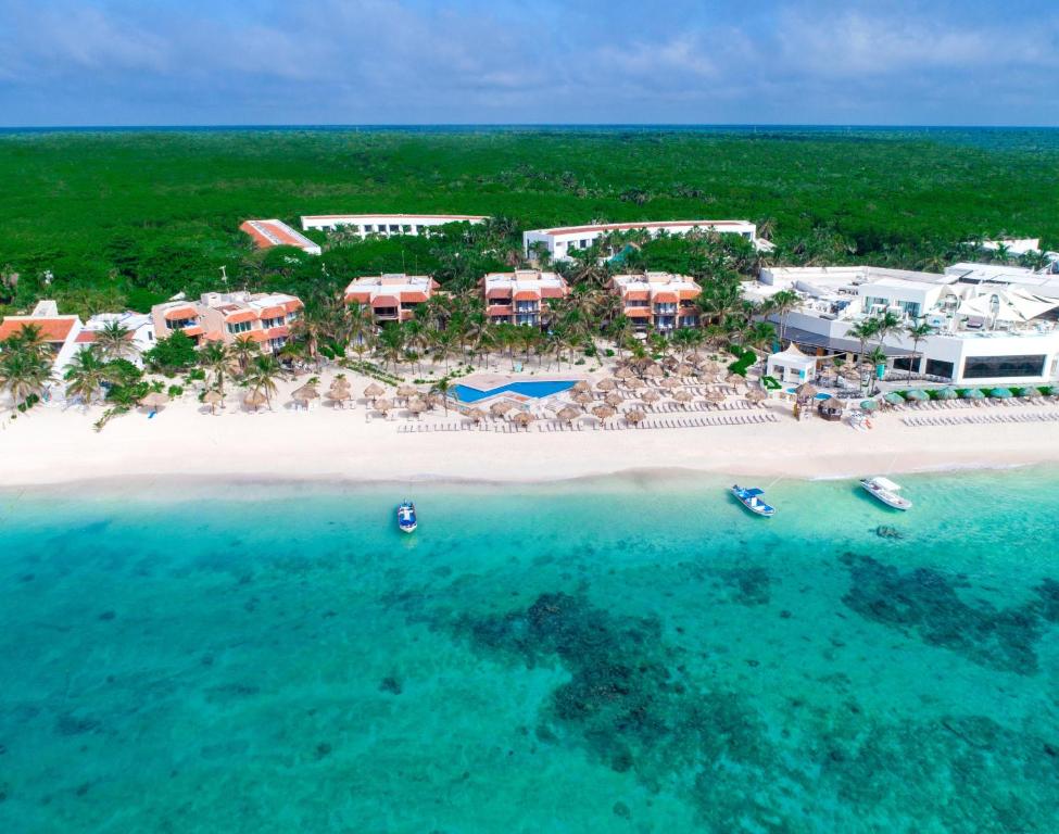 an aerial view of a resort on a beach at Grand Oasis Tulum Riviera - All Inclusive in Akumal