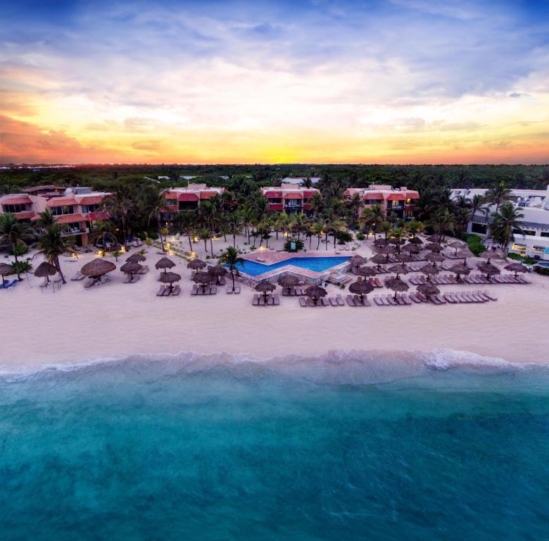 an aerial view of a resort on the beach at Grand Oasis Tulum Riviera - All Inclusive in Akumal