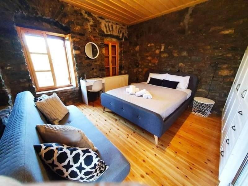 Ένα ή περισσότερα κρεβάτια σε δωμάτιο στο Domna's House