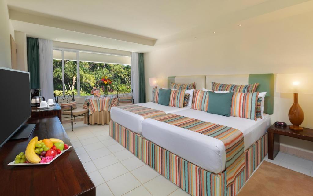 Postel nebo postele na pokoji v ubytování Grand Oasis Palm - All inclusive