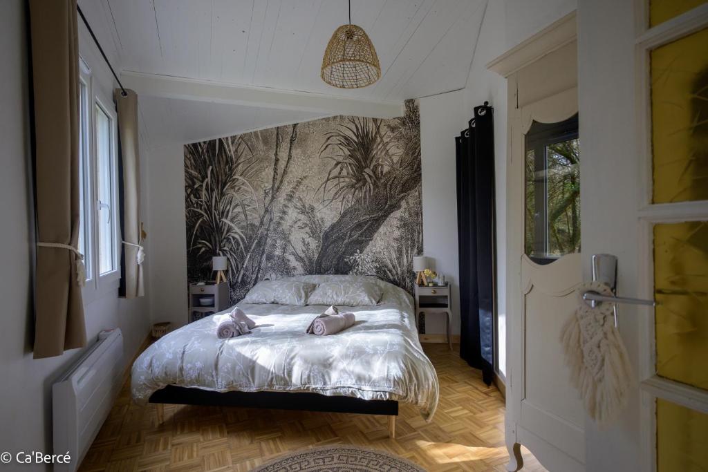 a bedroom with a bed with twoeddy bears on it at Cabercé Thoiré in Thoiré-sur-Dinan