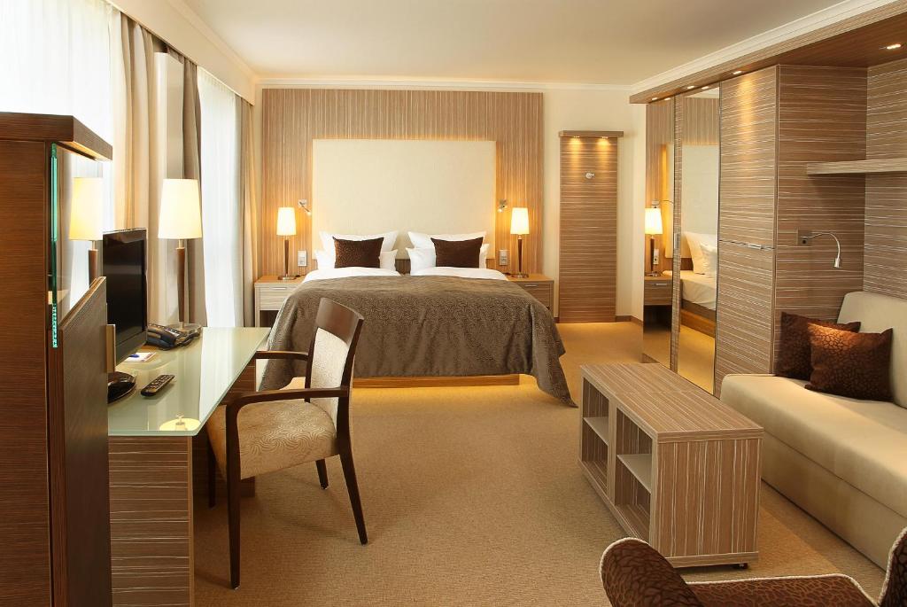 Postel nebo postele na pokoji v ubytování Strandhotel Duhnen