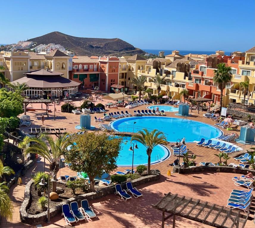 an aerial view of a resort with a swimming pool at Sunny terrace & pool in Playa de las Americas