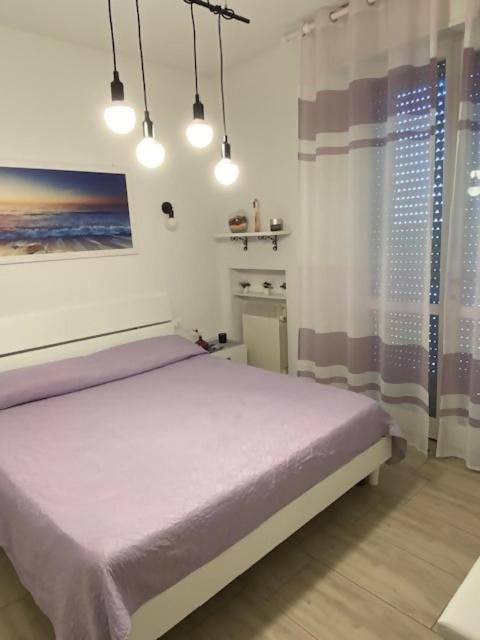 Postel nebo postele na pokoji v ubytování Viola lido adriano