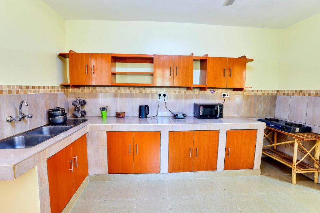 Kuchyň nebo kuchyňský kout v ubytování Diani Beach Gold Apartments