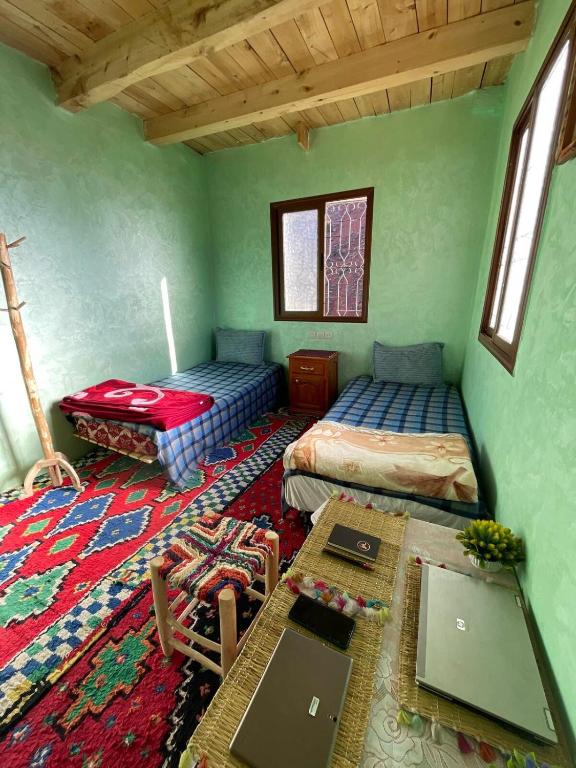 Postel nebo postele na pokoji v ubytování Dar Megdaz