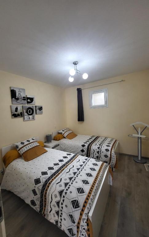 Postel nebo postele na pokoji v ubytování LE TOURISTIC Appartements