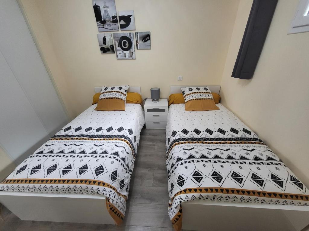 Postel nebo postele na pokoji v ubytování LE TOURISTIC Appartements