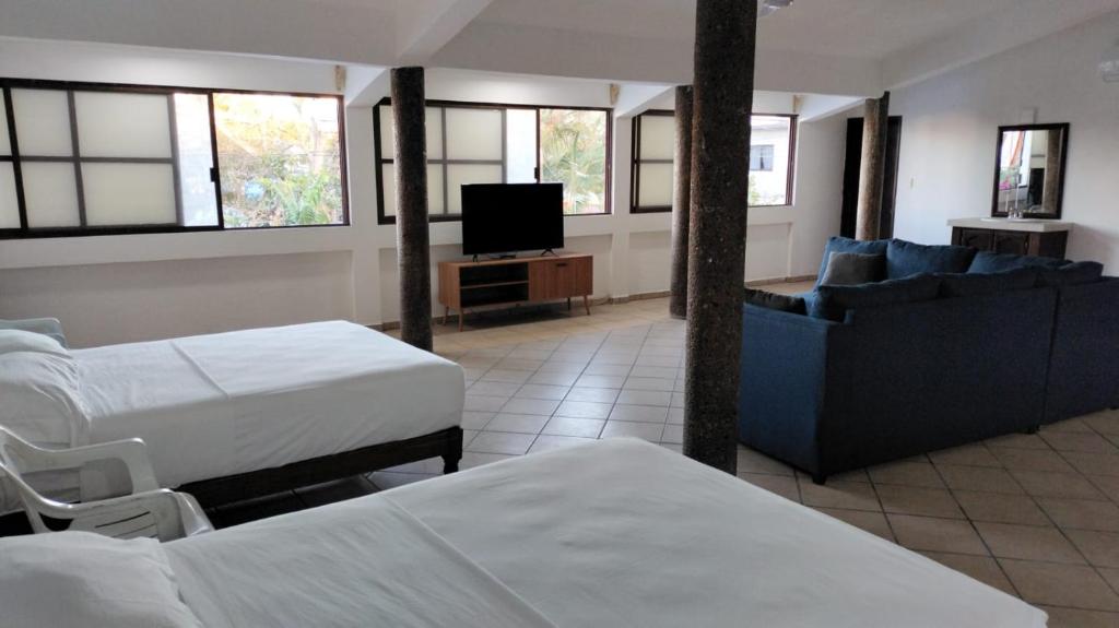 Postel nebo postele na pokoji v ubytování Don Luis Hostal - Sucursal Galeana - Tecolutla