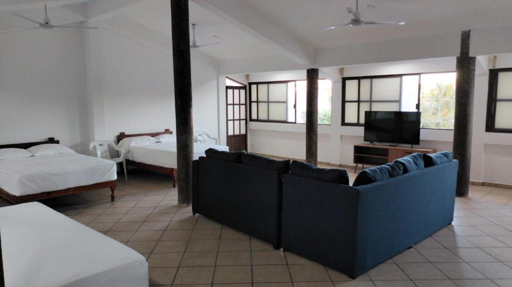 Postel nebo postele na pokoji v ubytování Don Luis Hostal - Sucursal Galeana - Tecolutla