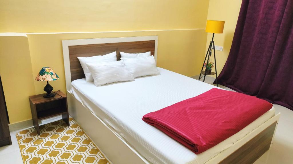 Postel nebo postele na pokoji v ubytování Bliss Homestay