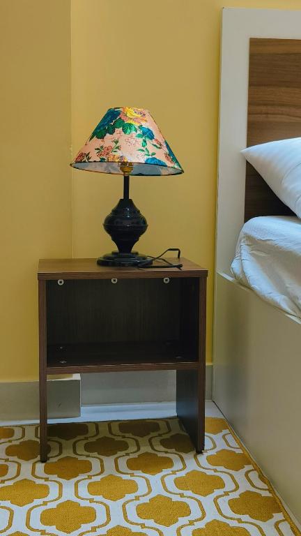 Postel nebo postele na pokoji v ubytování Bliss Homestay
