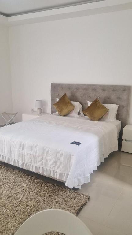 Postel nebo postele na pokoji v ubytování Residencial Ru-B