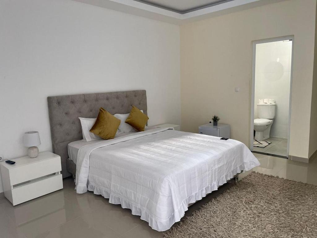 Postel nebo postele na pokoji v ubytování Residencial Ru-B