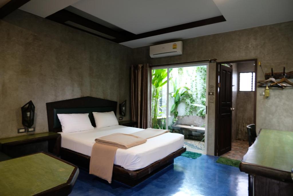 Postel nebo postele na pokoji v ubytování บ้านณัฐวรรณ หัวหิน - Baan Nattawan Huahin