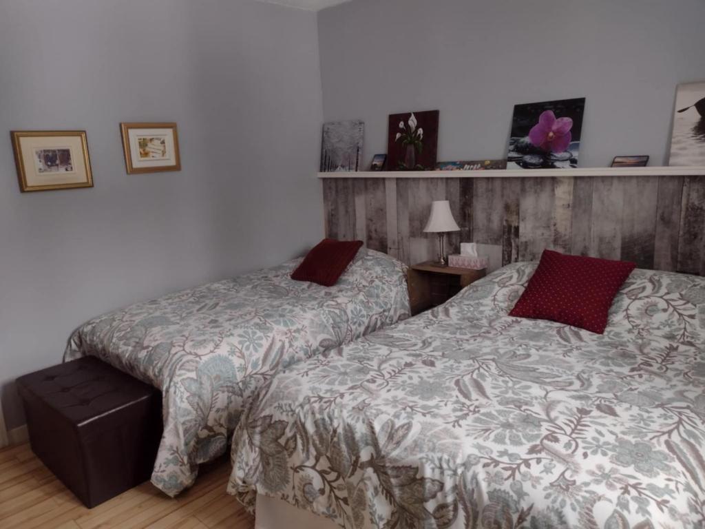 Uma cama ou camas num quarto em Gîte Marie-Claire