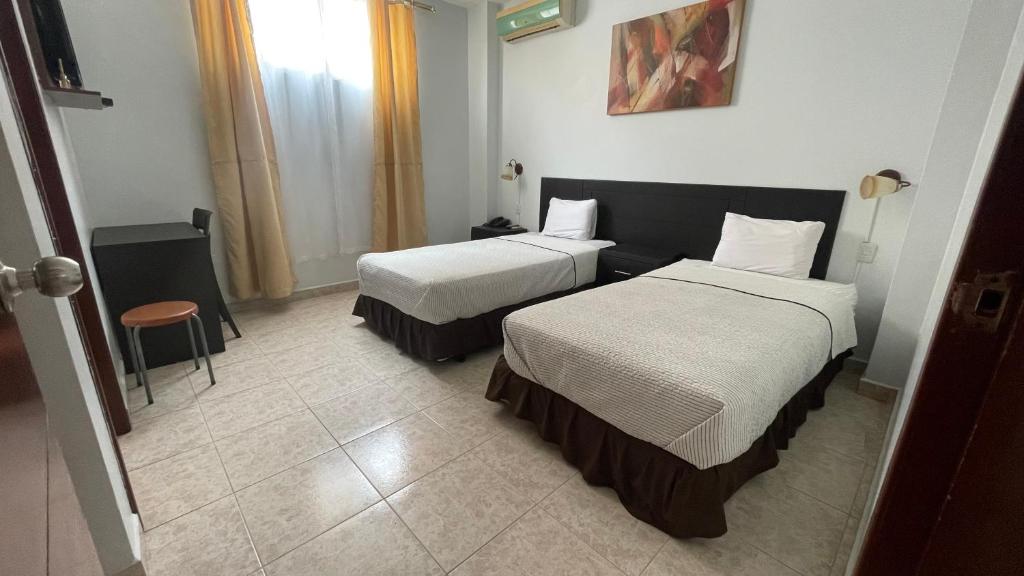Postel nebo postele na pokoji v ubytování Hotel Air Suites