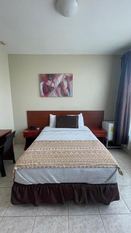 Postel nebo postele na pokoji v ubytování Hotel Air Suites
