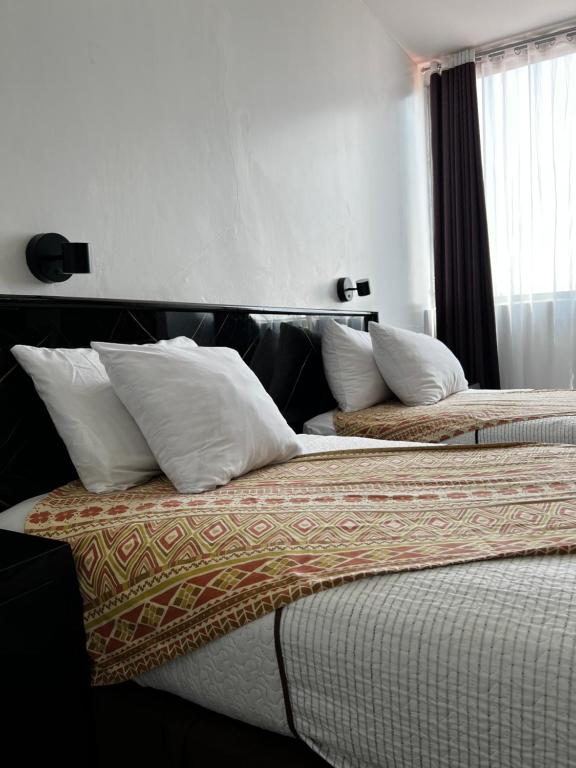 Postel nebo postele na pokoji v ubytování Hotel Air Suites