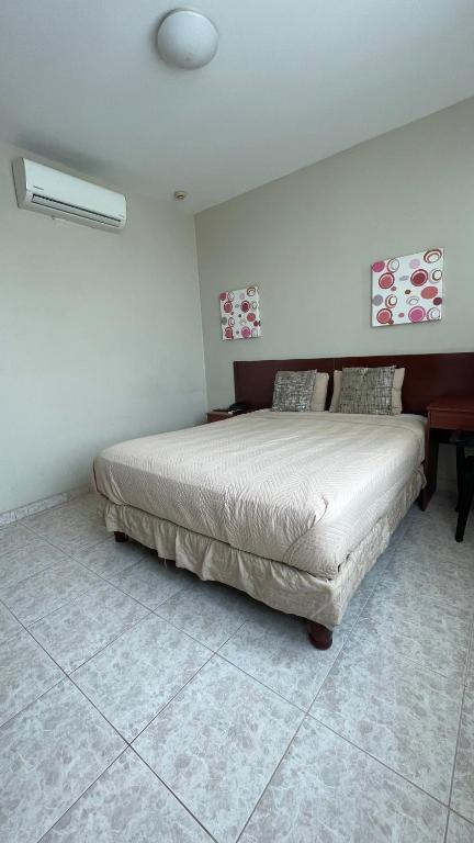 Postel nebo postele na pokoji v ubytování Hotel Air Suites