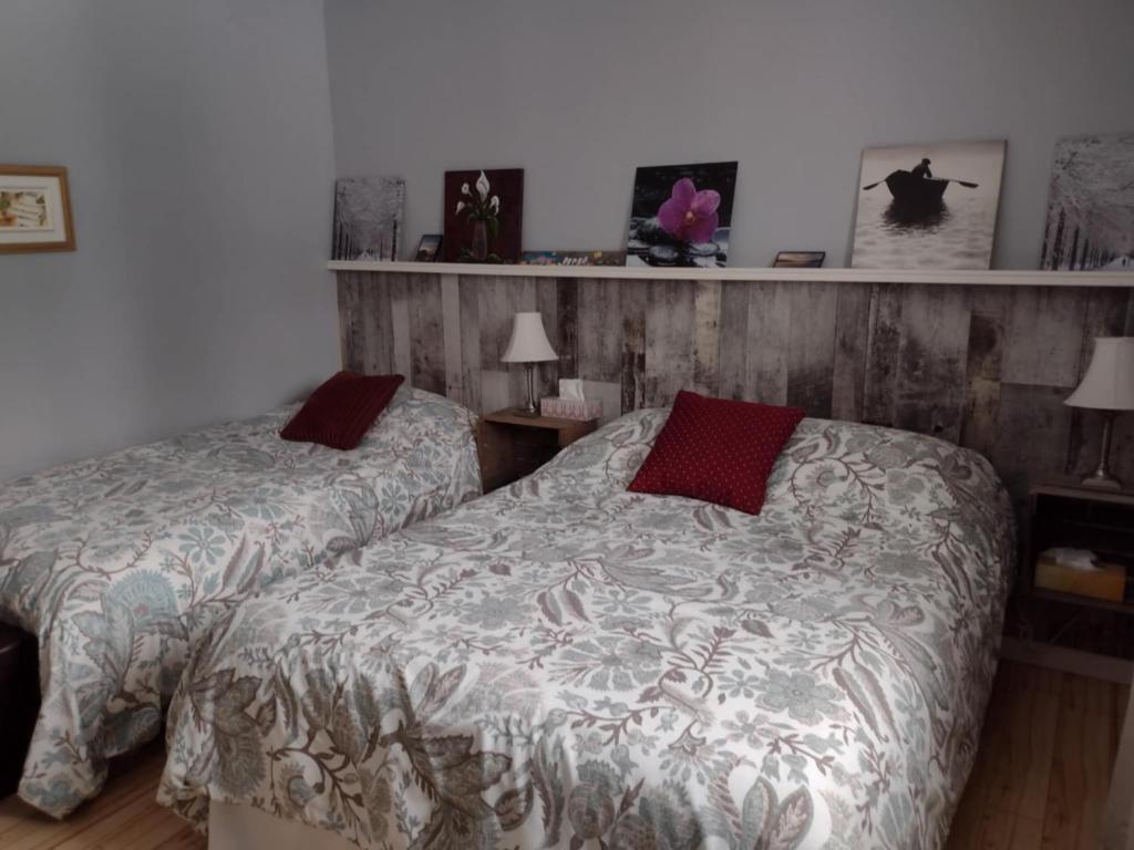 Uma cama ou camas num quarto em Gîte Marie-Claire