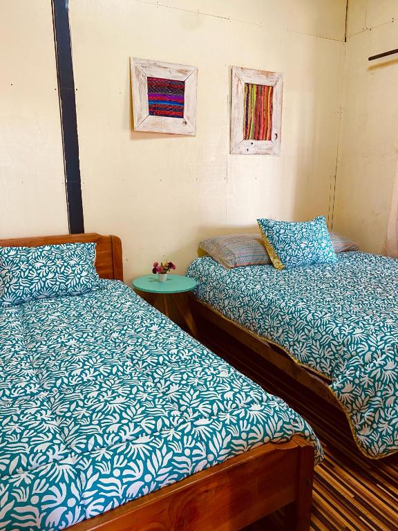Postel nebo postele na pokoji v ubytování Hostal María Lucía