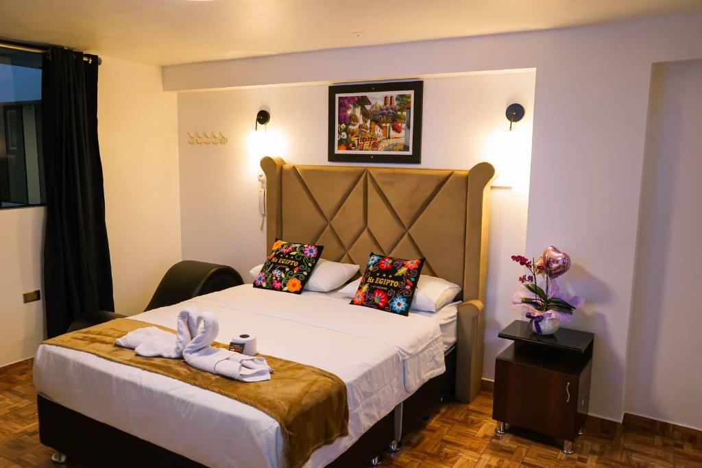 Postel nebo postele na pokoji v ubytování HOSTAl EGIPTO
