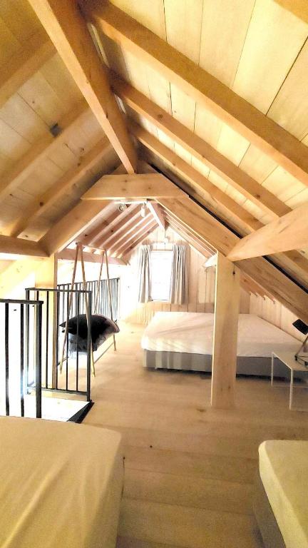 Postel nebo postele na pokoji v ubytování Boerderaaj vakantiewoning