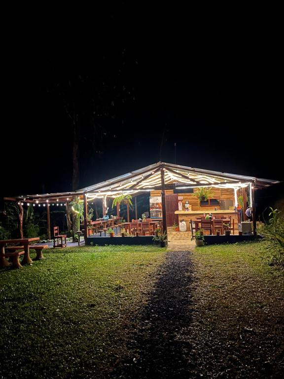 a building with lights on it at night at Pozas y Cascadas La Presa in Río Cuarto