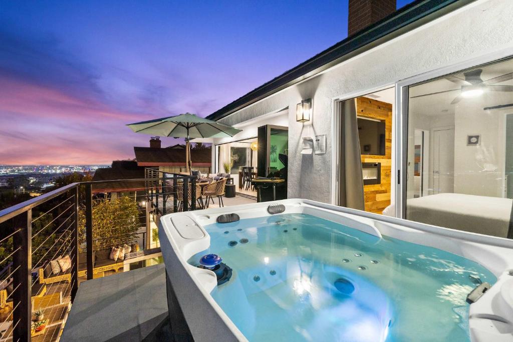 a hot tub on the balcony of a house at The California - On Top of San Diego in a Hot Tub in San Diego