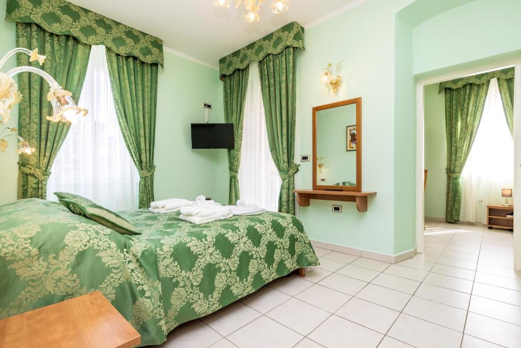 Postel nebo postele na pokoji v ubytování Villa Cassia
