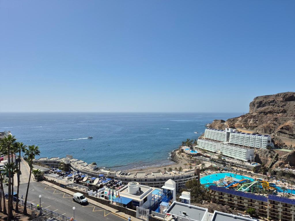 a view of the beach and the ocean at Taurito Luxholidays ocean view in Taurito