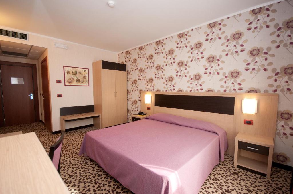 Postel nebo postele na pokoji v ubytování Hotel Brindor