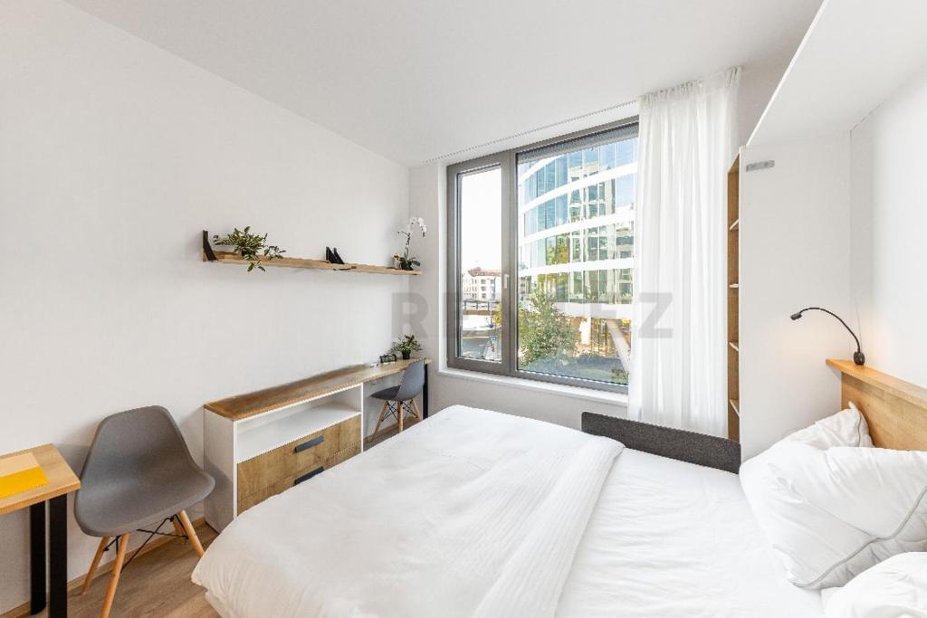 Postel nebo postele na pokoji v ubytování MyMozart Residence Lux Studio