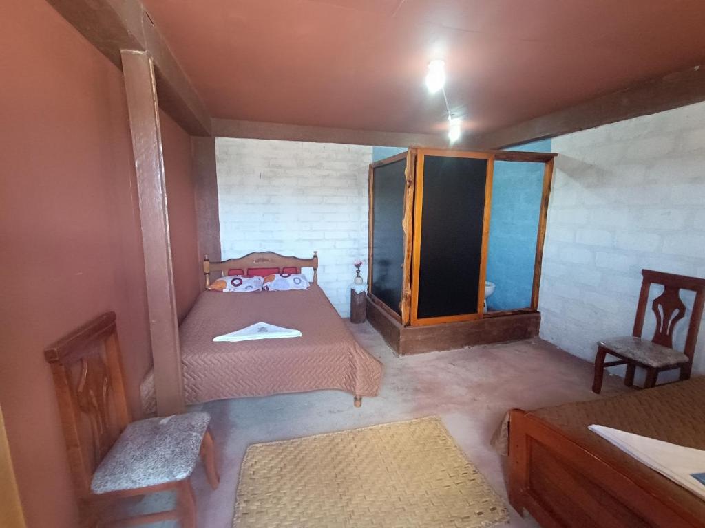 Postel nebo postele na pokoji v ubytování Casa Pukyu Pata