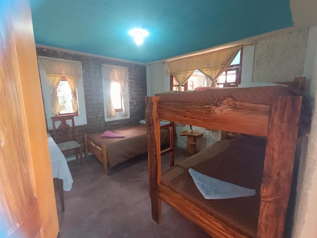 Postel nebo postele na pokoji v ubytování Casa Pukyu Pata